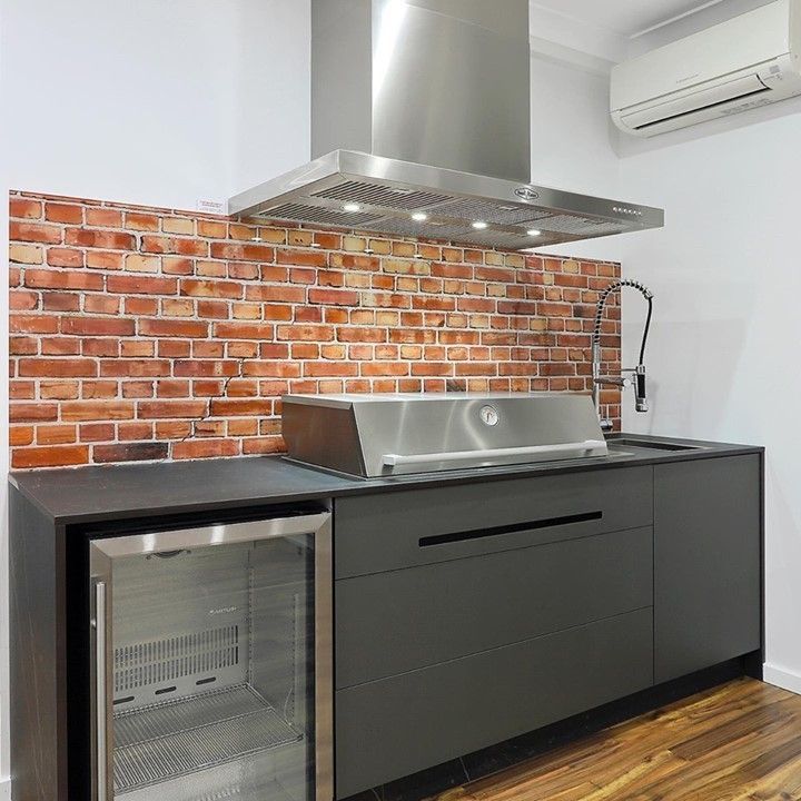 A Kitchen With a Brick Wall , Stainless Steel Appliances and a Refrigerator — DecoGlaze in Sutherland, NSW