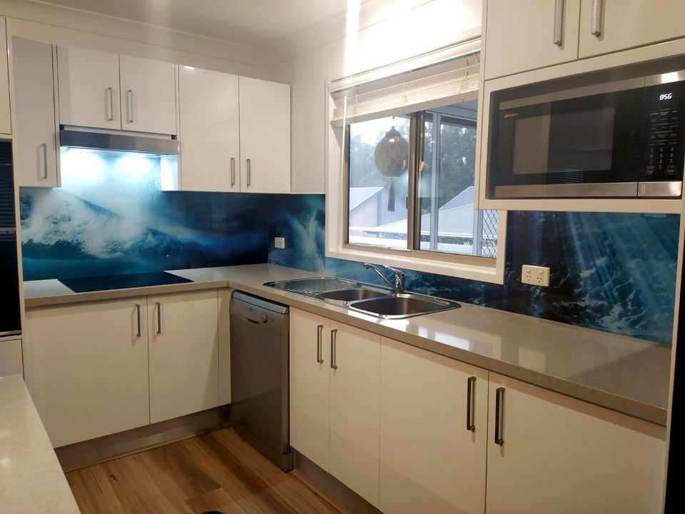 A Kitchen With White Cabinets , a Sink , a Microwave , and a Window — DecoGlaze in Bellevue Hill, NSW