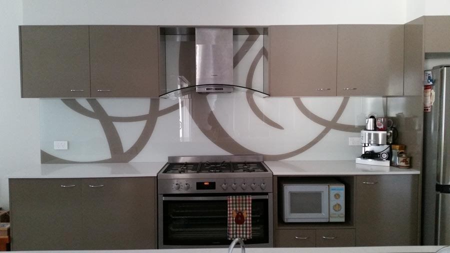 A Kitchen With a Stove Top Oven and a Microwave — DecoGlaze in Windsor, NSW