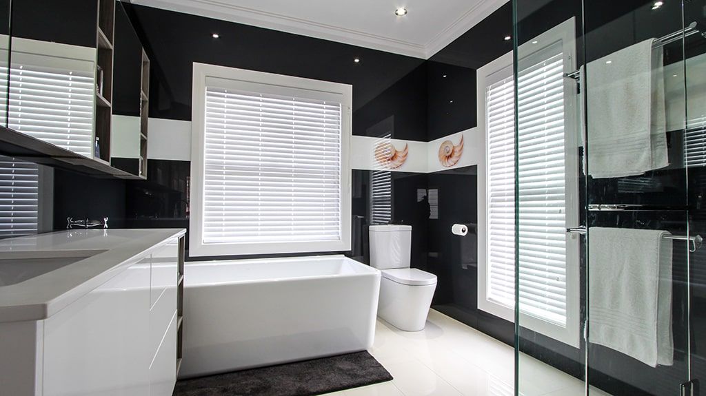A Bathroom With Black and White Walls and a Bathtub — DecoGlaze in Minchinbury, NSW