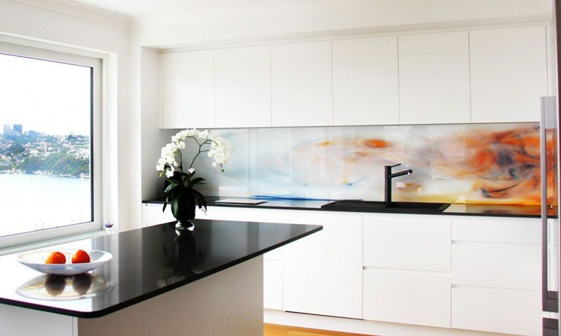 A Kitchen With White Cabinets and a Black Counter Top — DecoGlaze in Minchinbury, NSW
