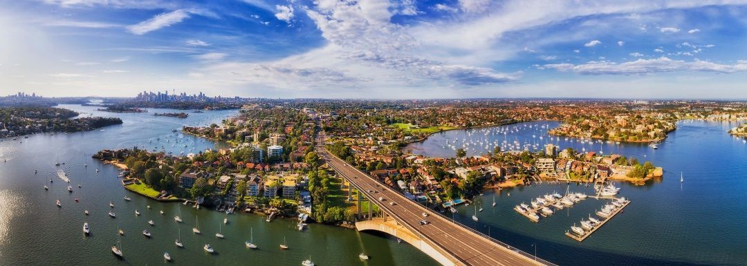 An Aerial View of a Bridge Over a Body of Water Surrounded by Boats — DecoGlaze in Drummoyne, NSW