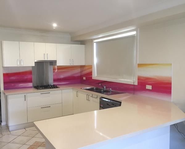 A Kitchen With White Cabinets and Pink Counter Tops — DecoGlaze in Camden, NSW