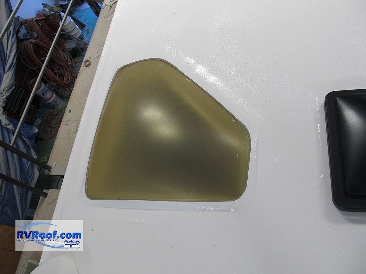 A picture of a triangle on a white surface with rvroof.com in the corner