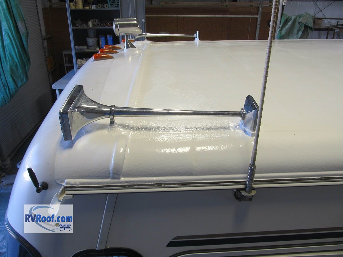 A white roof with a horn attached to it