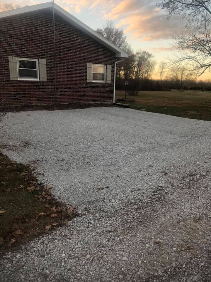 A construction worker wearing a blue hard hat is working on a roof