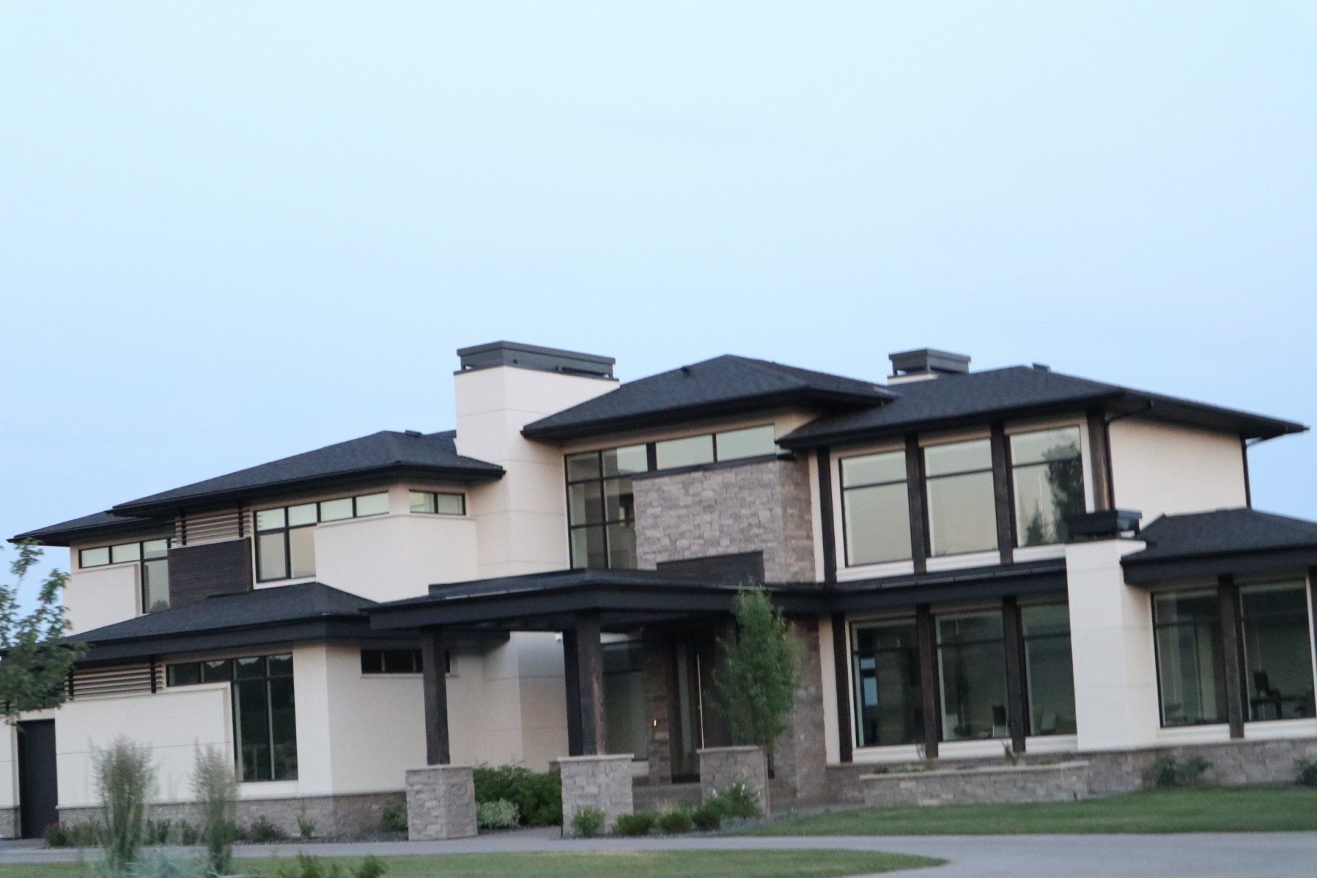 a large white house with a black roof
