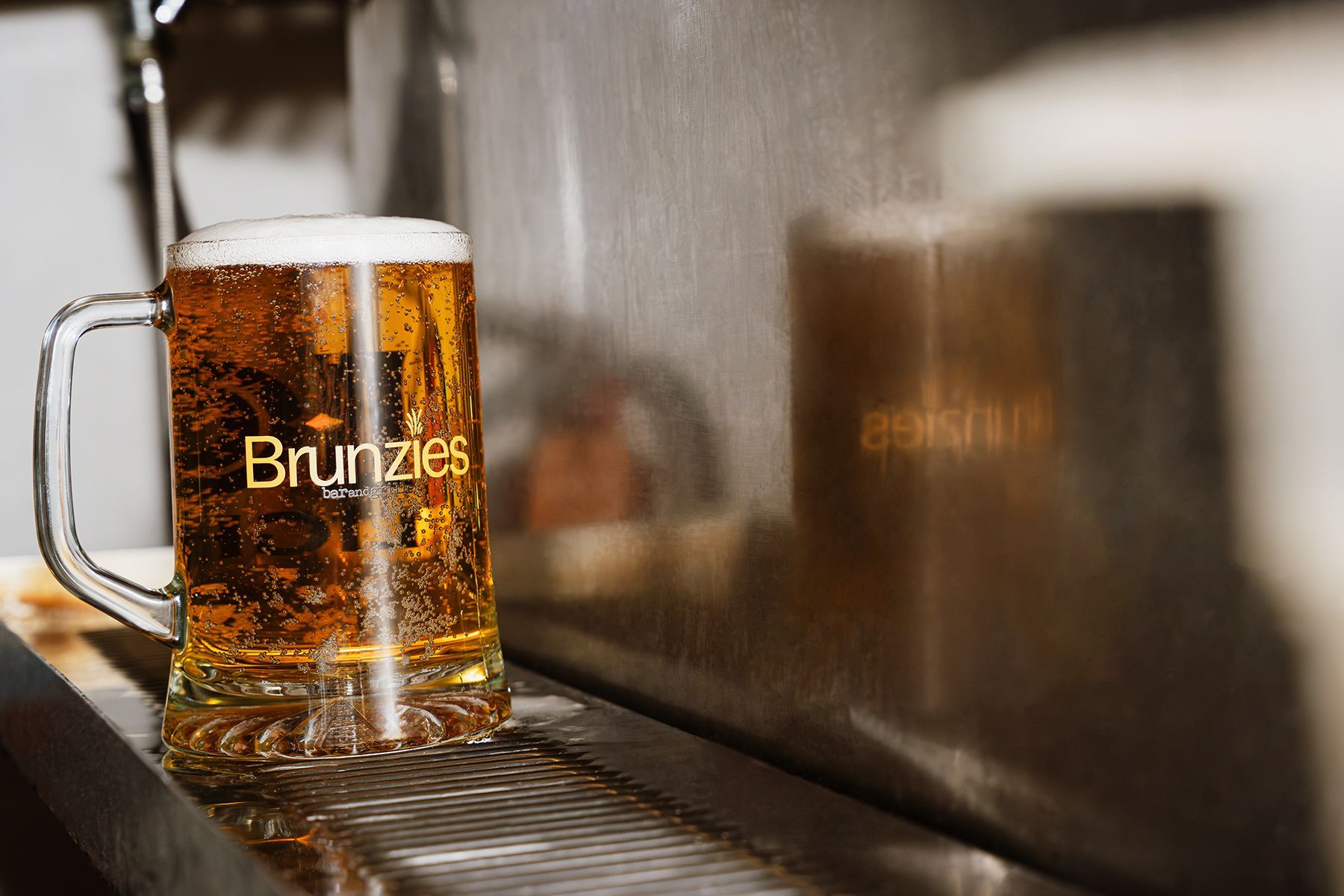 Glass beer mug with foam, 