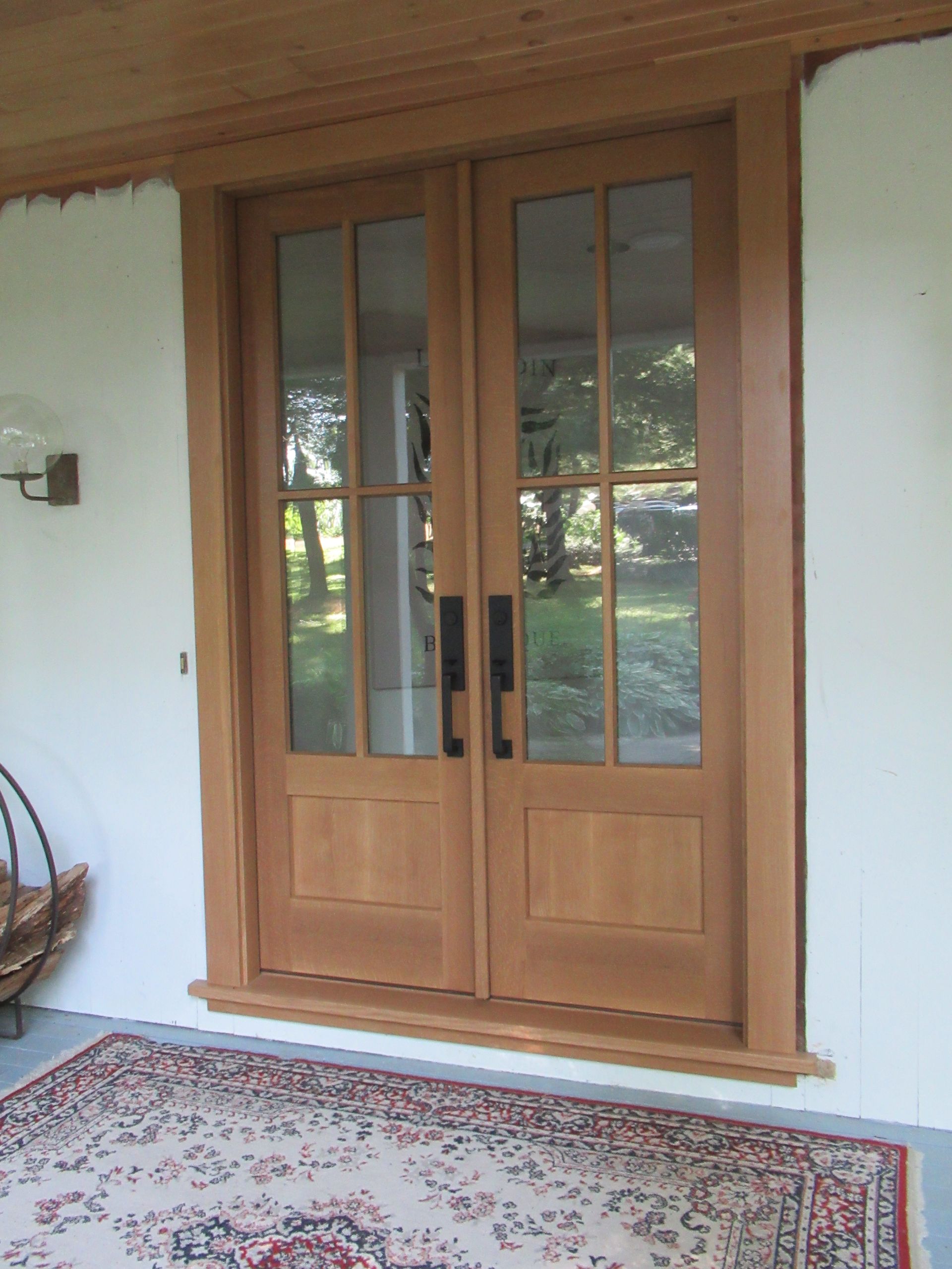 A Wooden Door with A Rug in Front of It | Narvon, PA | JDH Custom Millwork