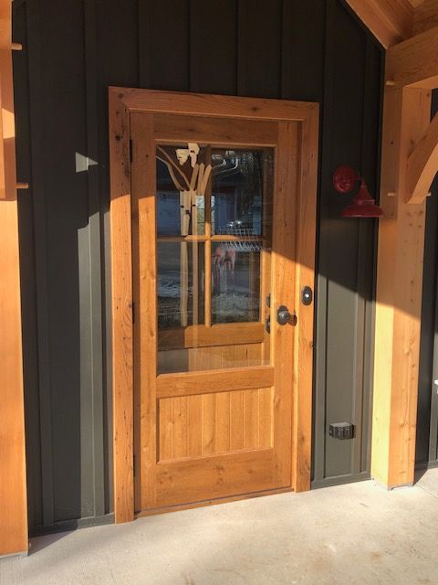 A Wooden Door with A Glass Window Is on The Side of A Building | Narvon, PA | JDH Custom Millwork