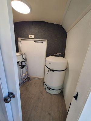 A laundry room with a washer and dryer in it.