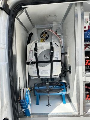 A water heater is sitting inside of a van.