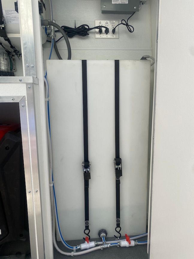 A large white tank with two valves attached to it