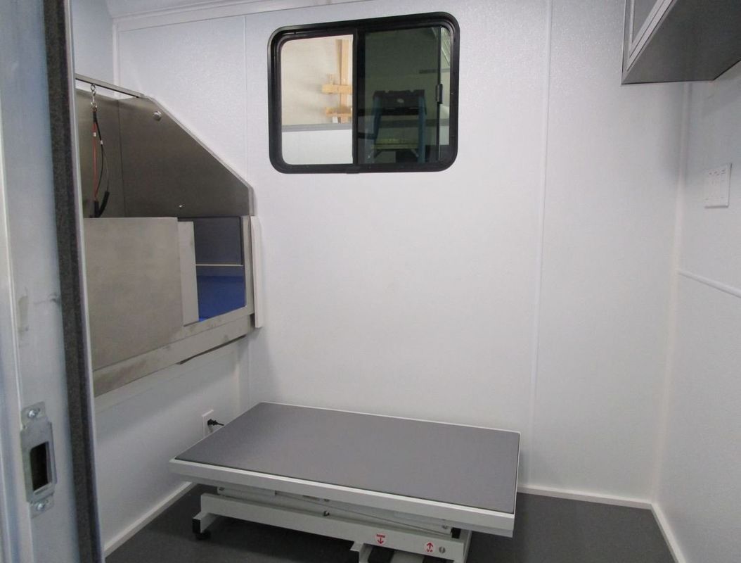 A small room with a bed and a window