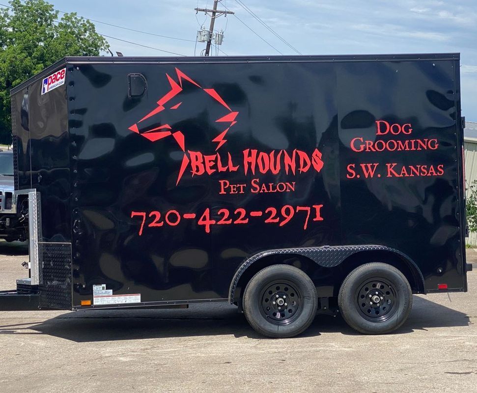 A black trailer for bell hounds pet salon in s.w. kansas
