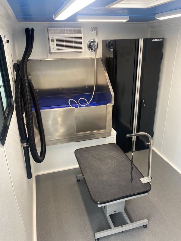 A room with a table and a sink in it