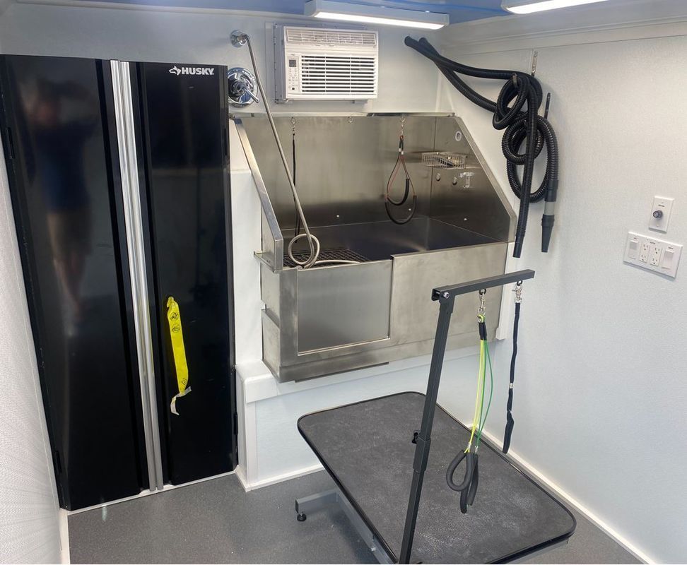 A room with a sink and a table in it