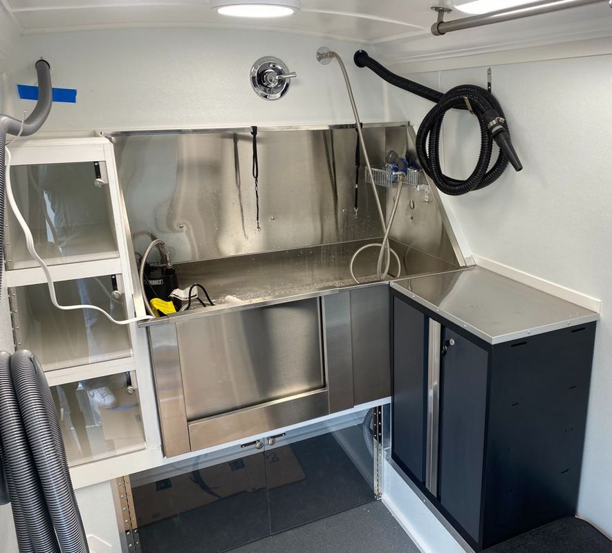There is a stainless steel sink in the middle of the room.