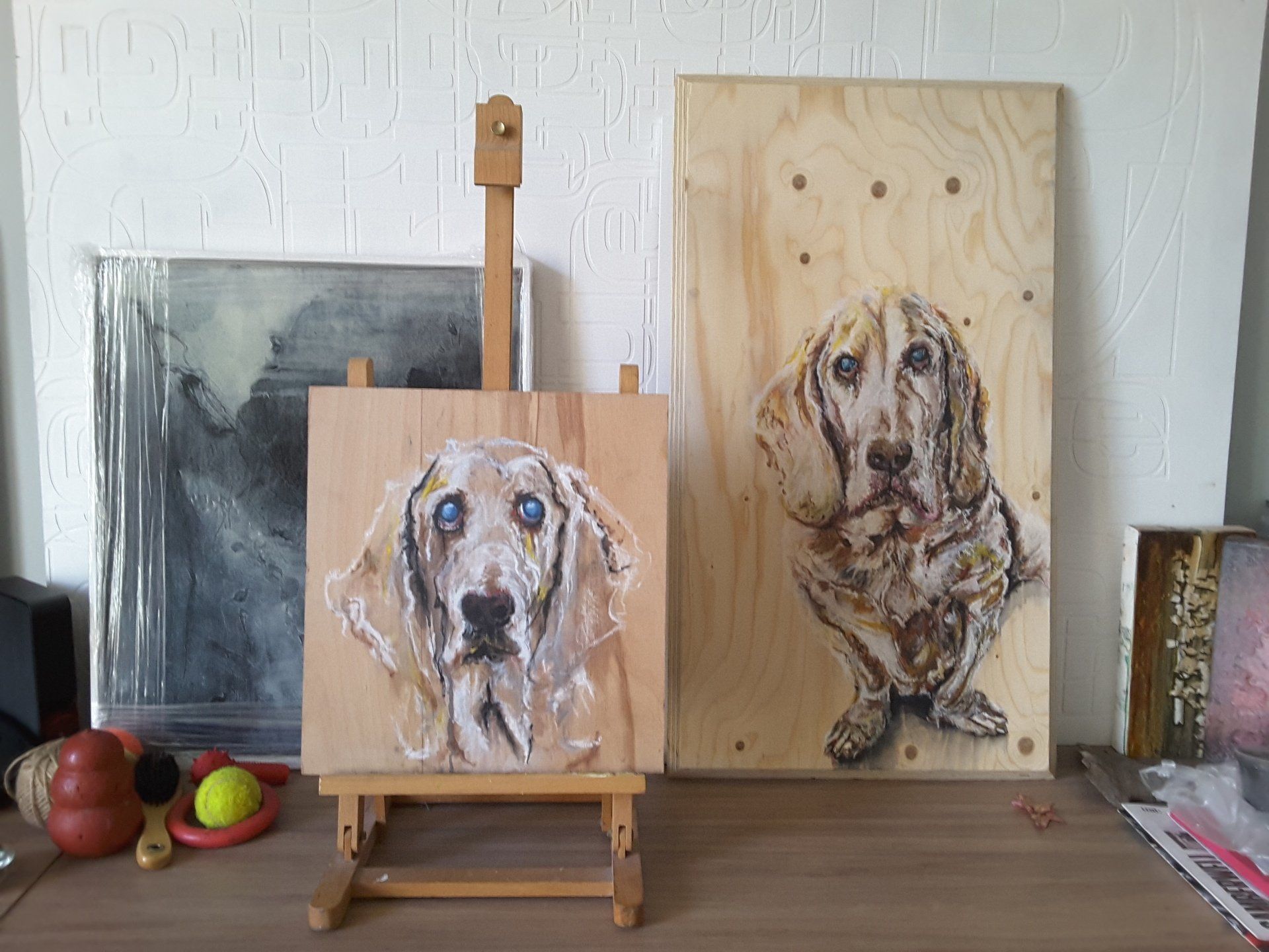 finished artworks of dog on wooden panels