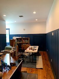 There is a table in the middle of the room.