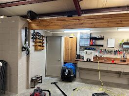 There is a vacuum cleaner in the middle of the room.