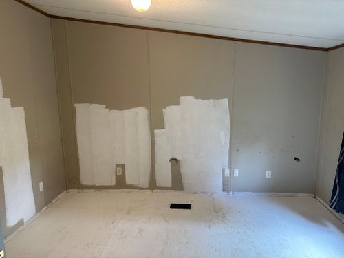 There is a hole in the wall in the middle of the room.