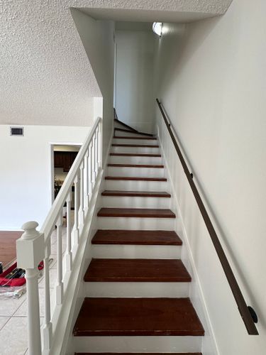 A set of stairs leading up to the second floor of a house.