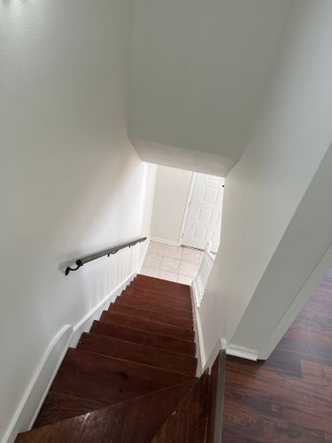 A wooden staircase leading up to the second floor of a house.