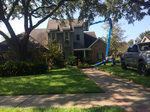 A large house with a truck parked in front of it.