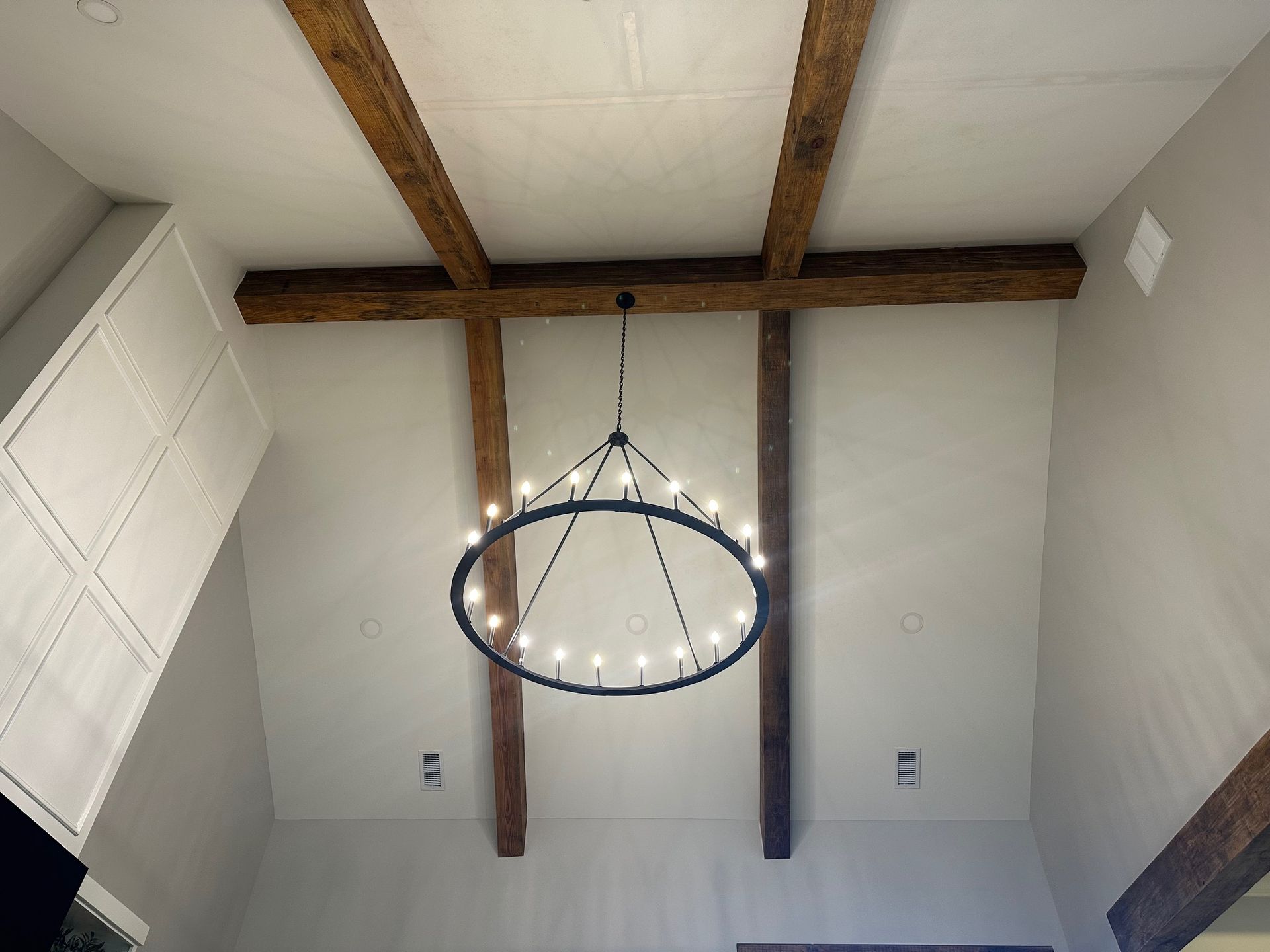 A house is being painted with a ladder attached to it.