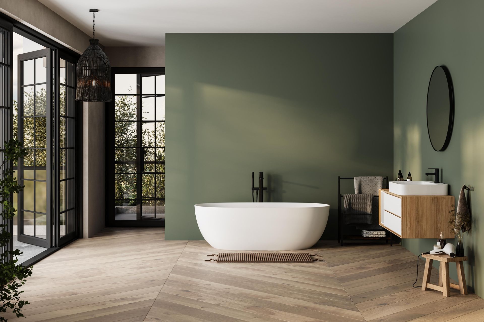 A bathroom with a bathtub , sink , mirror and green walls.