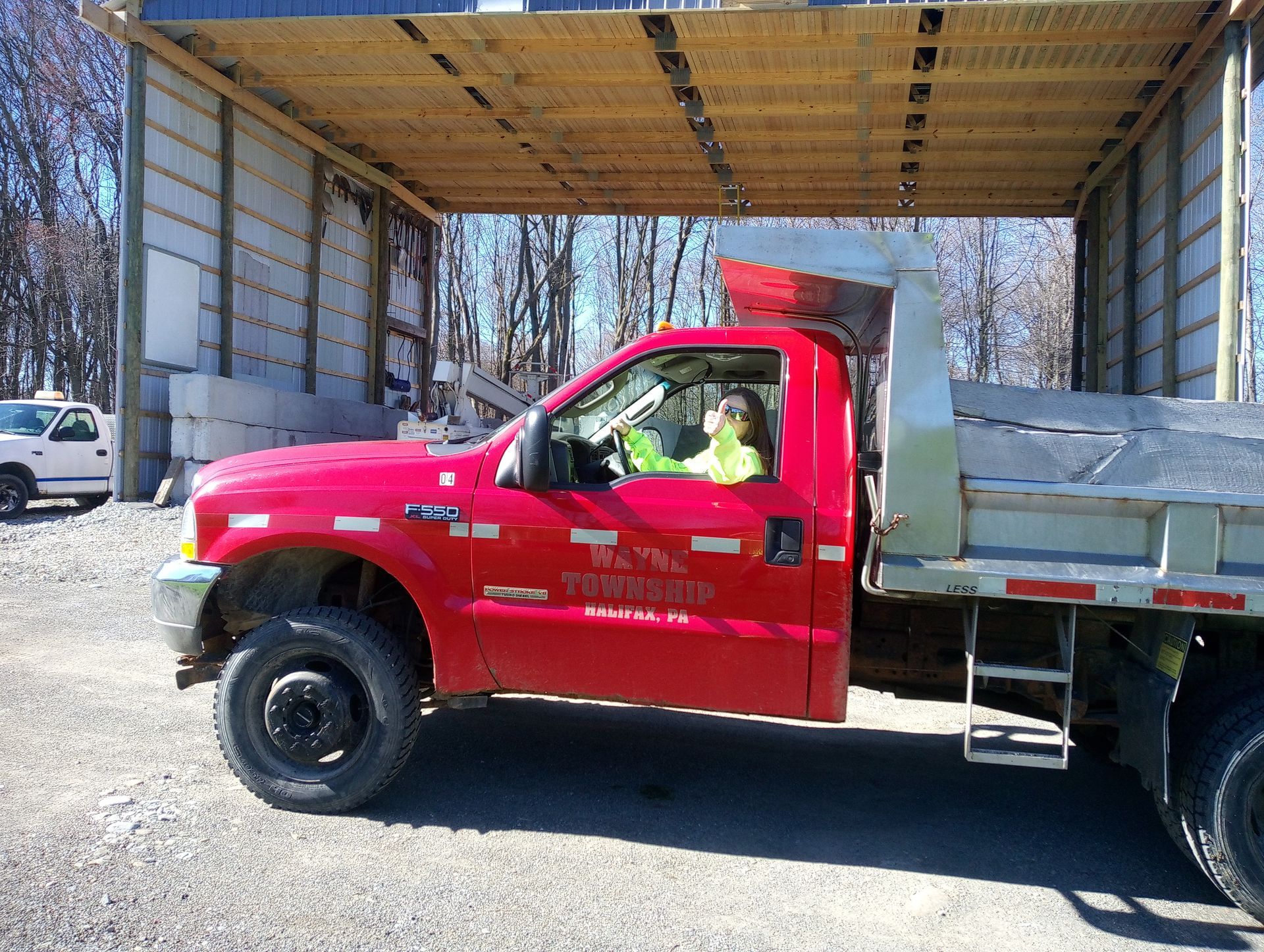 A red tow truck is parked in front of a building