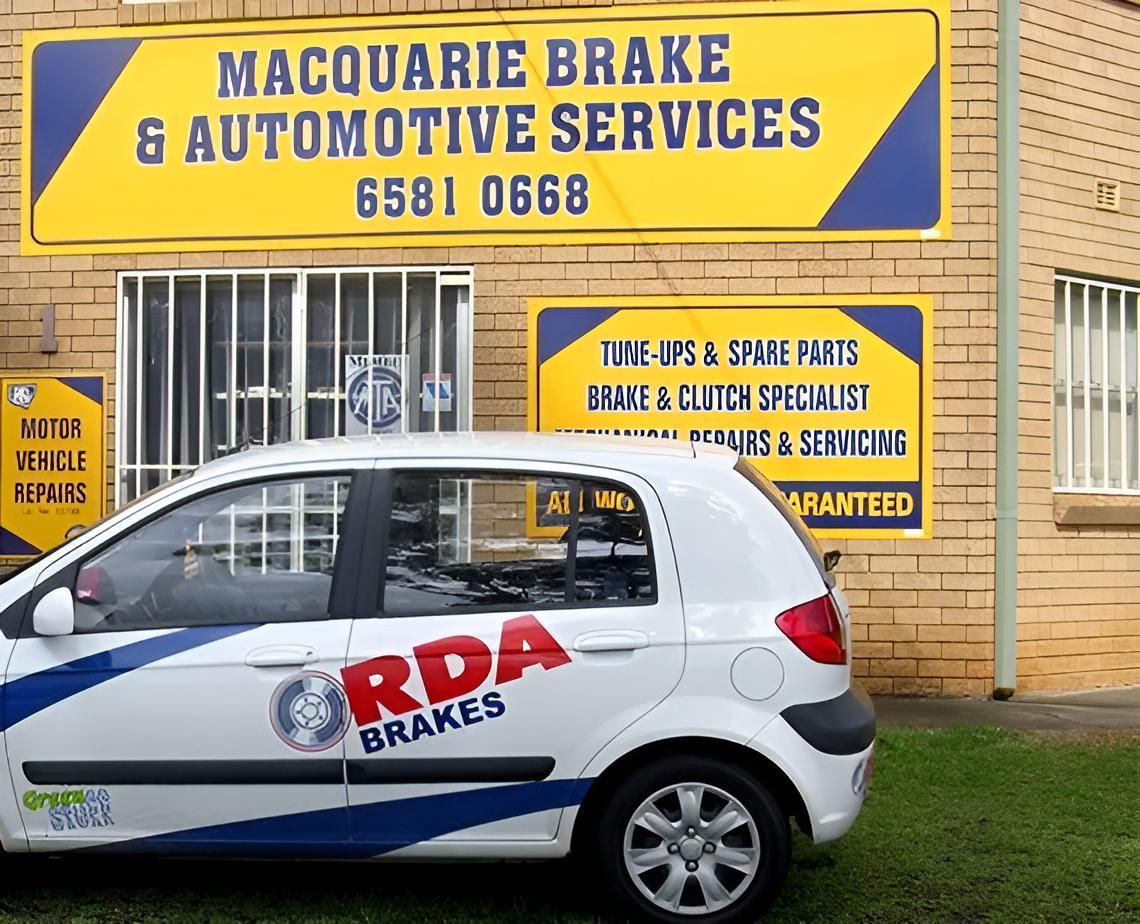 A Car is Parked in Front of a Building — Macquarie Brake & Automotive Services In Port Macquarie, NSW