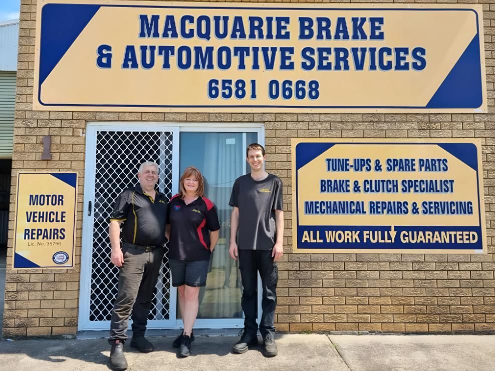 A Group of People Standing in Front of a Building — Macquarie Brake & Automotive Services In Port Macquarie, NSW