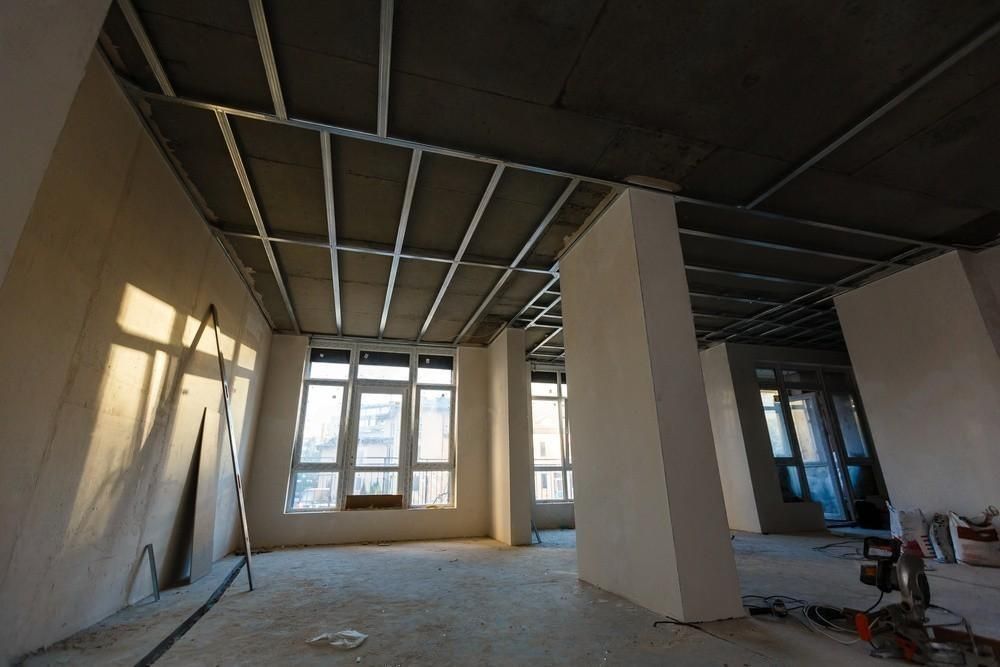 an empty room with a ceiling that is being built