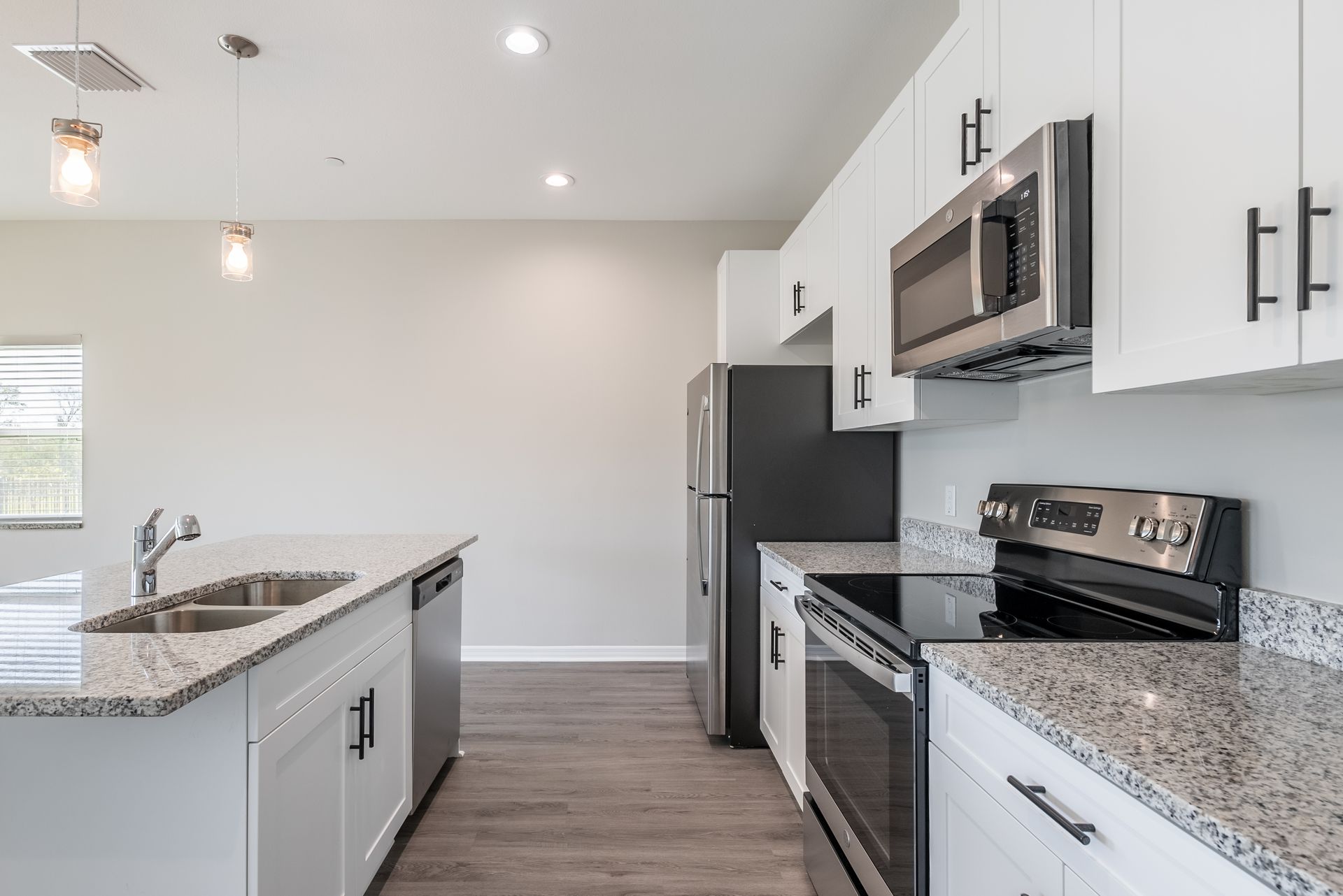 a kitchen with stainless steel appliances and granite counter tops 
