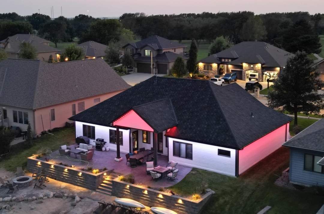 An aerial view of a house with a pink roof