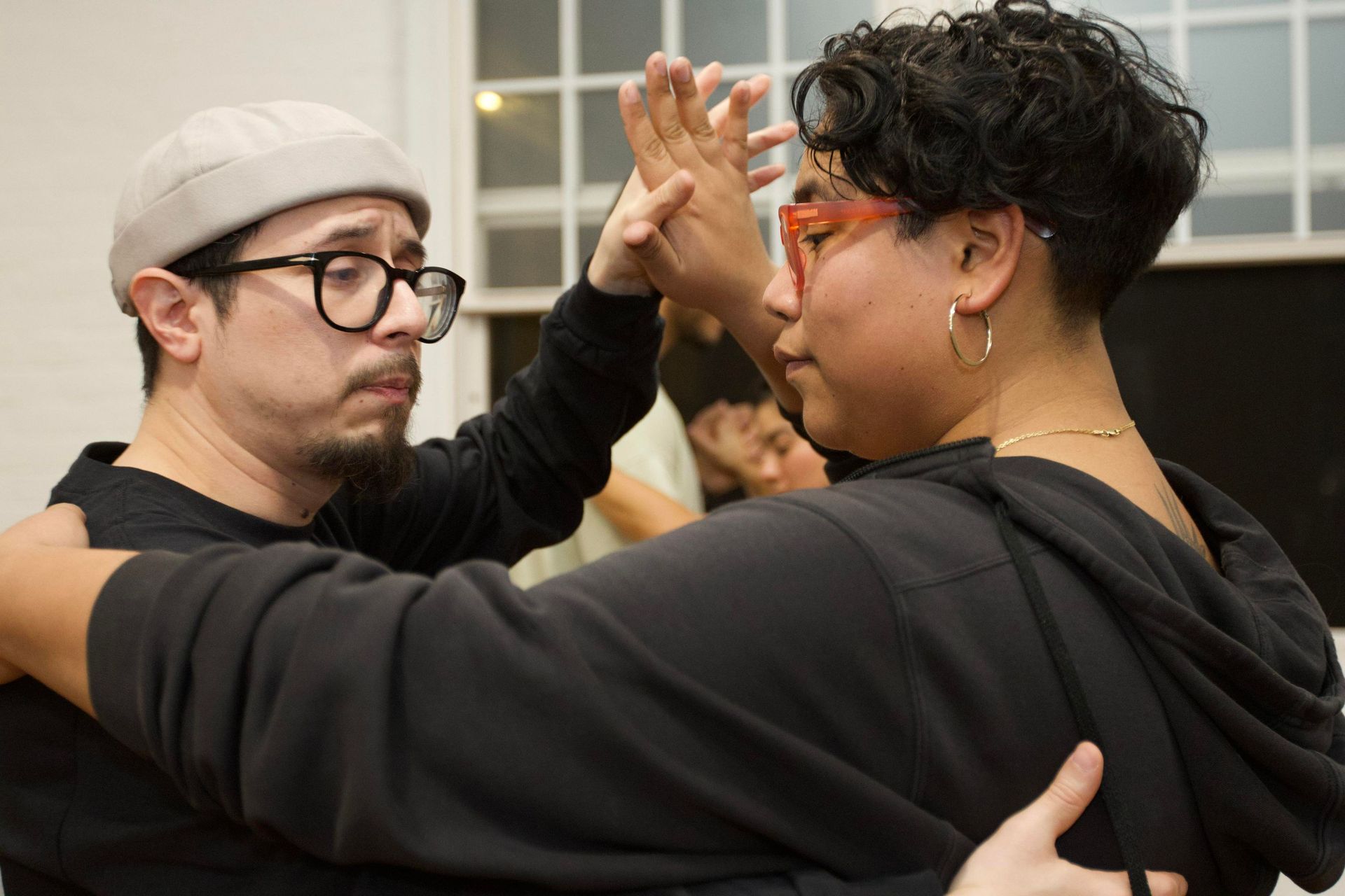 Instructors Brandon and Kristy demonstrate the closed position for partner work during a Bachata class.