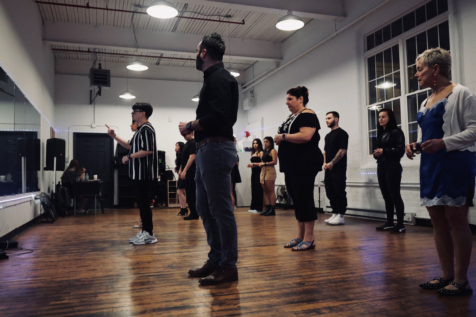 Instructor Brandon explains choreography to his students at a Kizomba workshop.