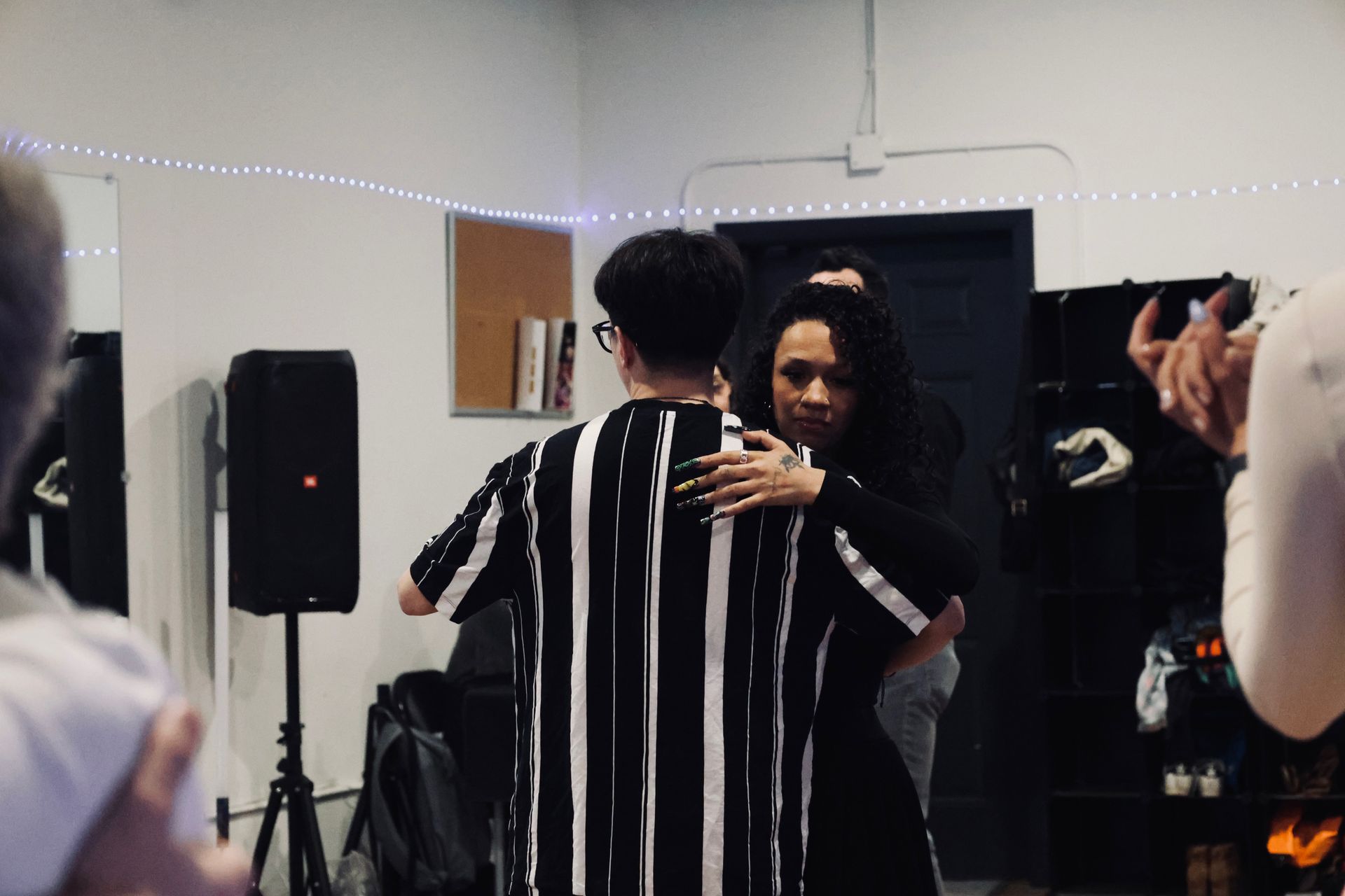 Instructor Brandon demonstrates choreography during a Kizomba workshop with his fellow female instructor.