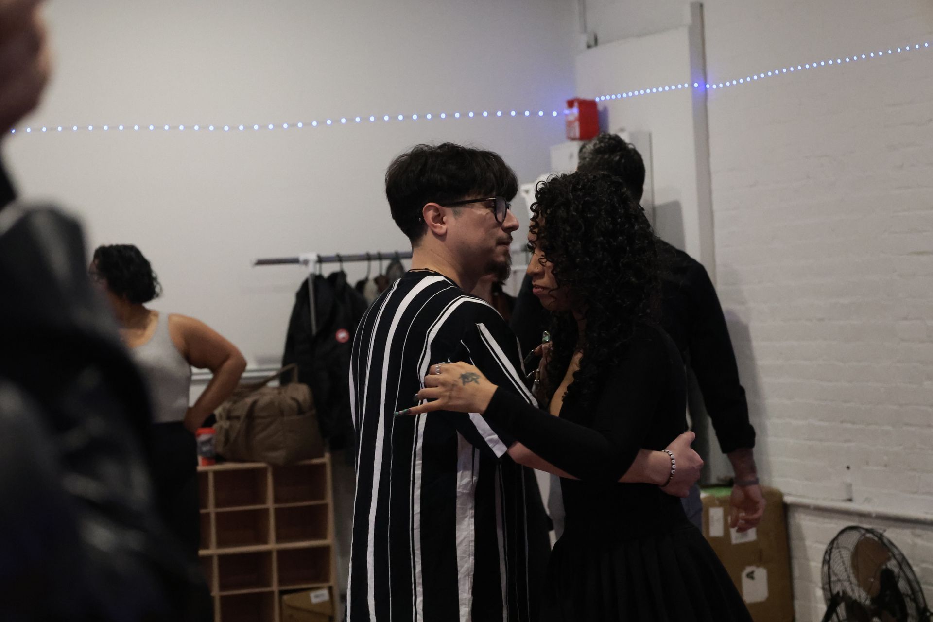 Instructor Brandon demonstrates choreography during a Kizomba workshop with his fellow female instructor.