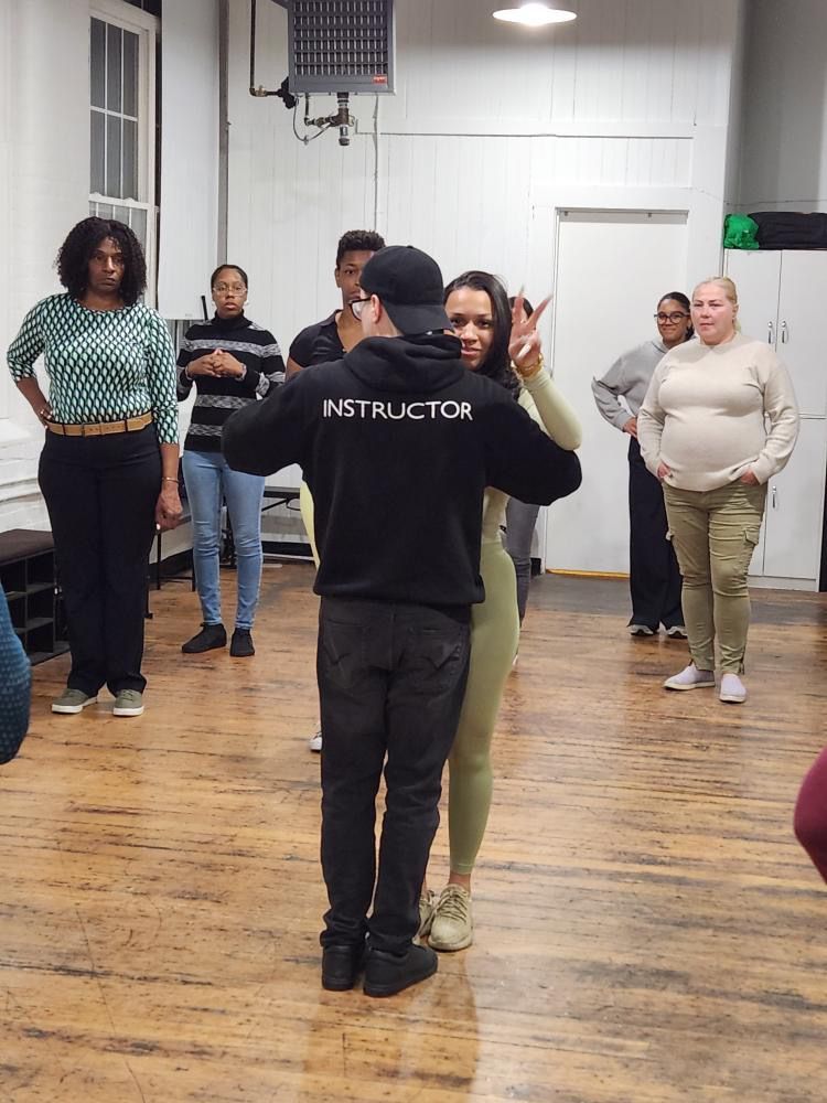Instructor Brandon demonstrates Kizomba partner work choreography.