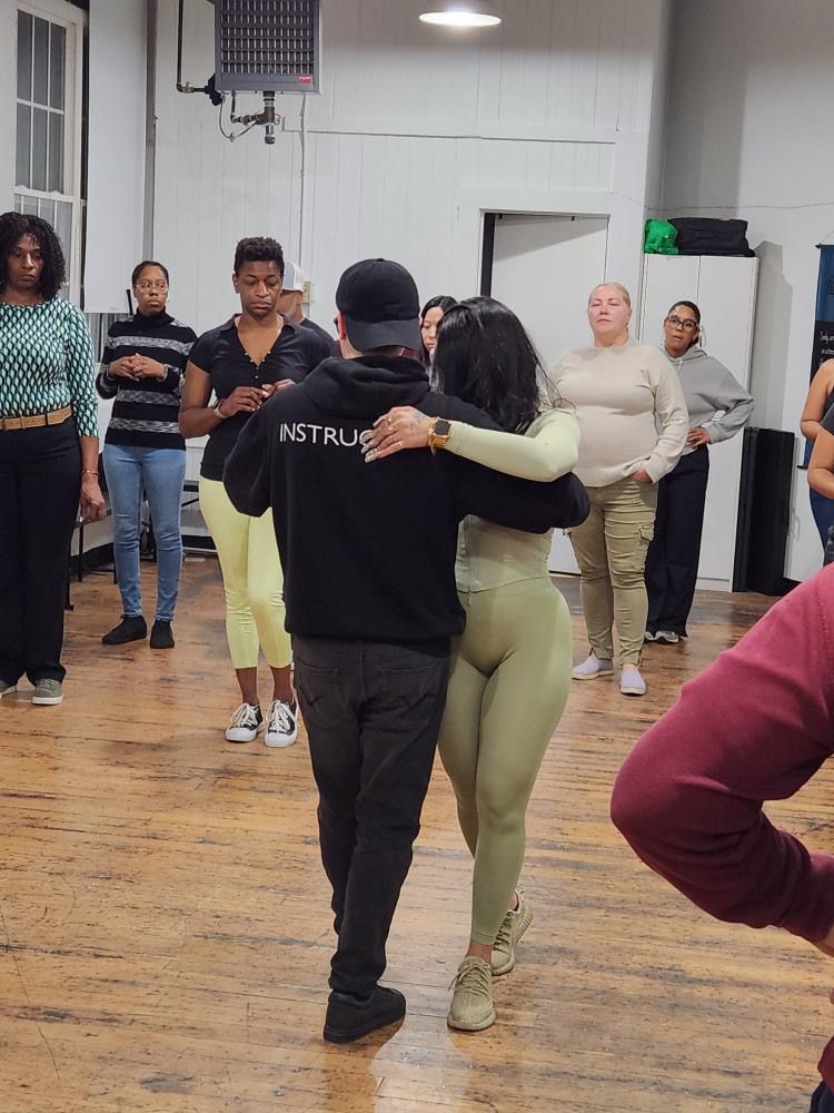 Instructor Brandon demonstrates Kizomba partner work choreography.