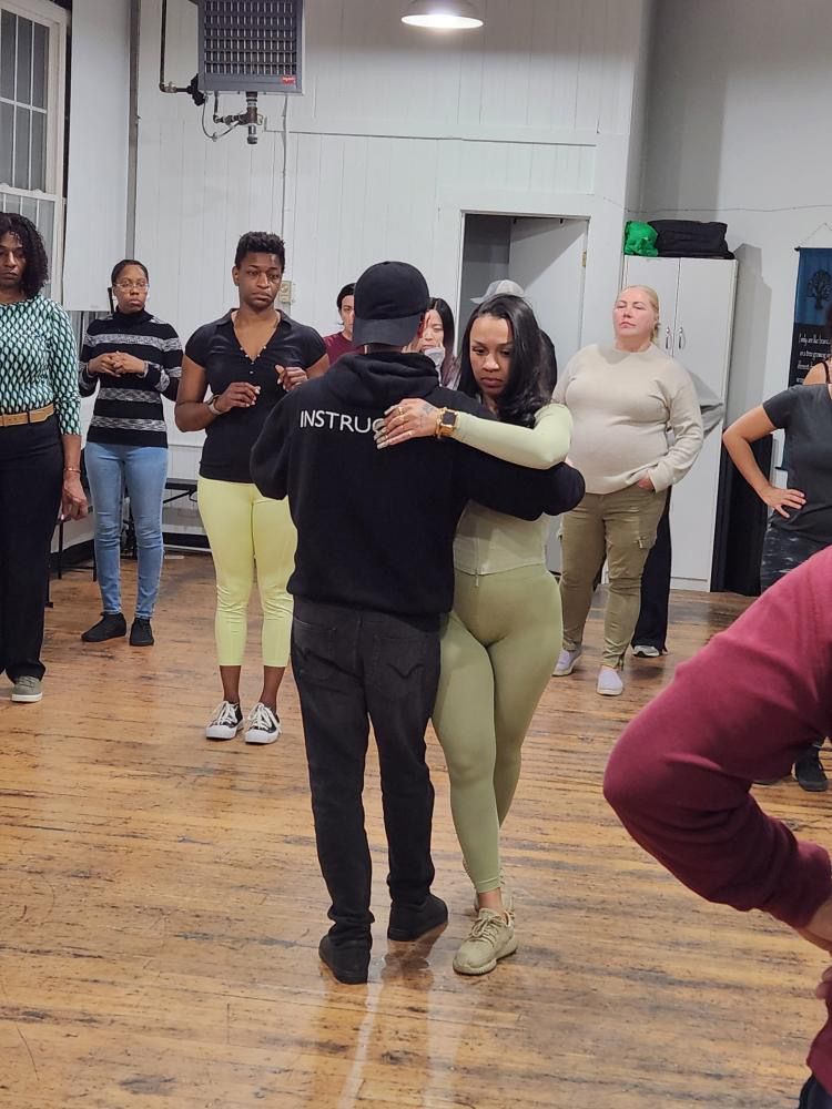 Instructor Brandon demonstrates Kizomba partner work choreography.