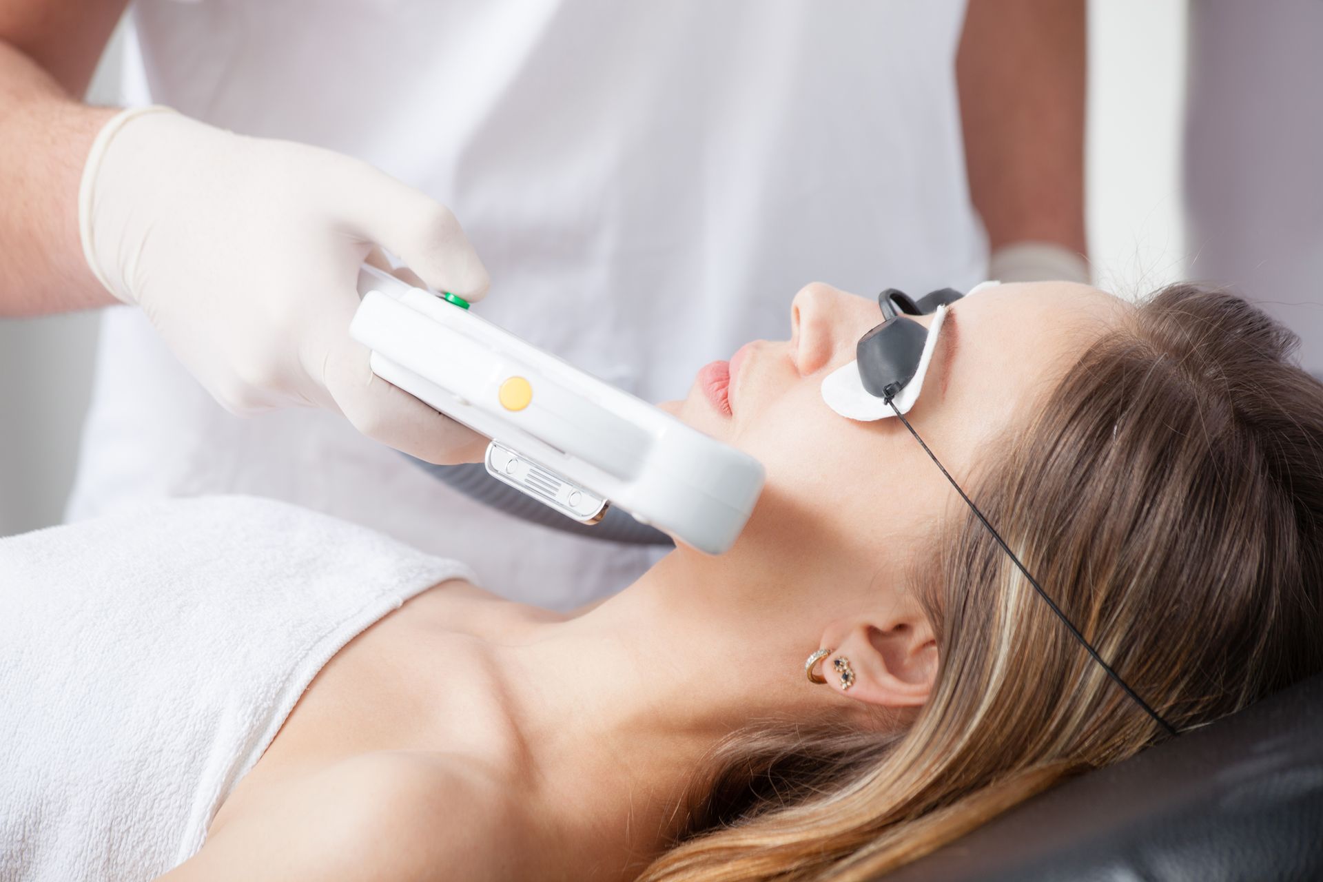 a woman getting a laser facial