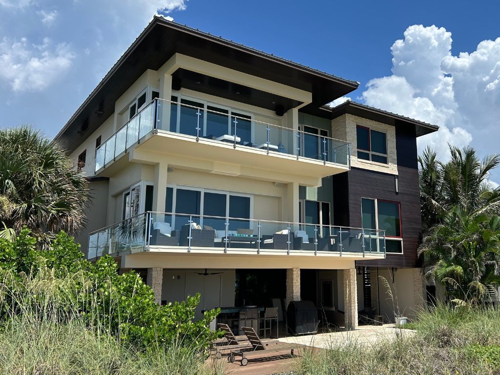 A large house with a lot of windows and balconies