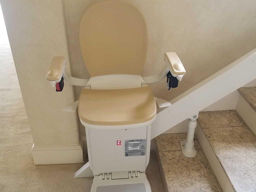 A toilet is sitting on top of a set of stairs.