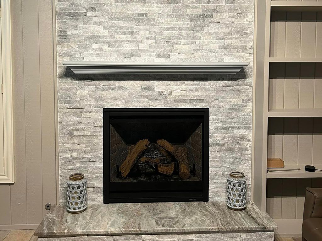 There is a fireplace in the middle of the room.