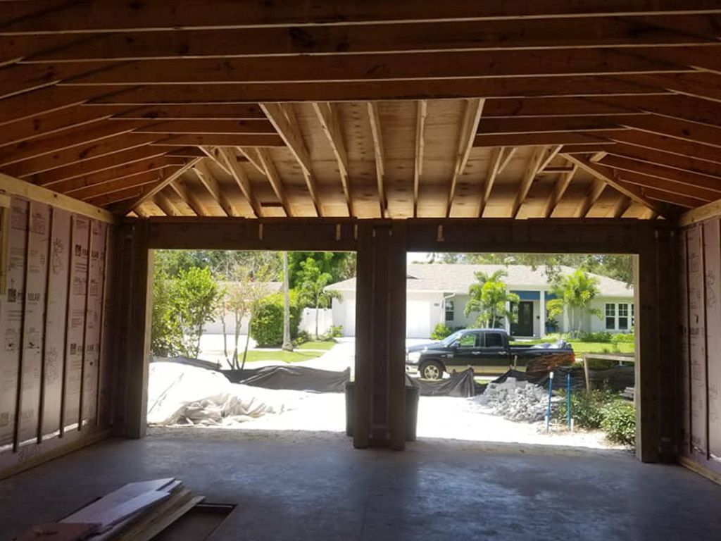 A car is parked in a garage under construction