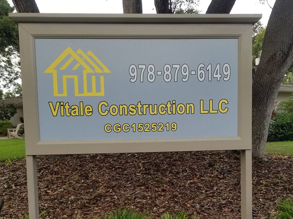 A vitale construction llc sign that is outside